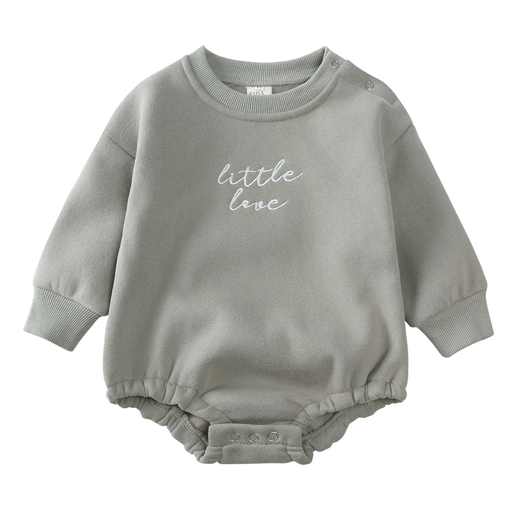 Gray cotton baby romper with white chest embroidery, long sleeves, and snap closures