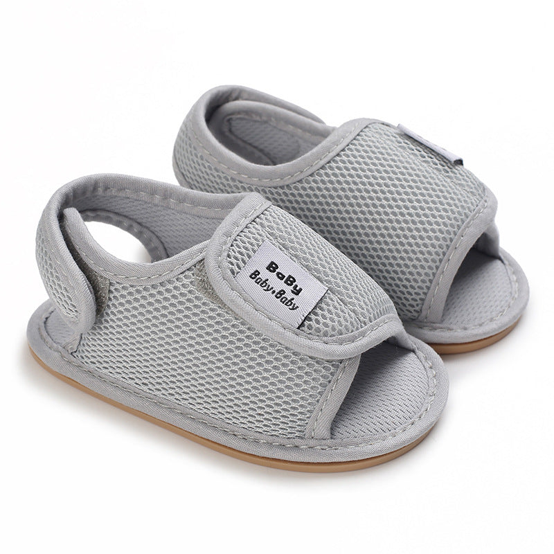 Gray mesh baby sandals with open toes and hook-and-loop straps