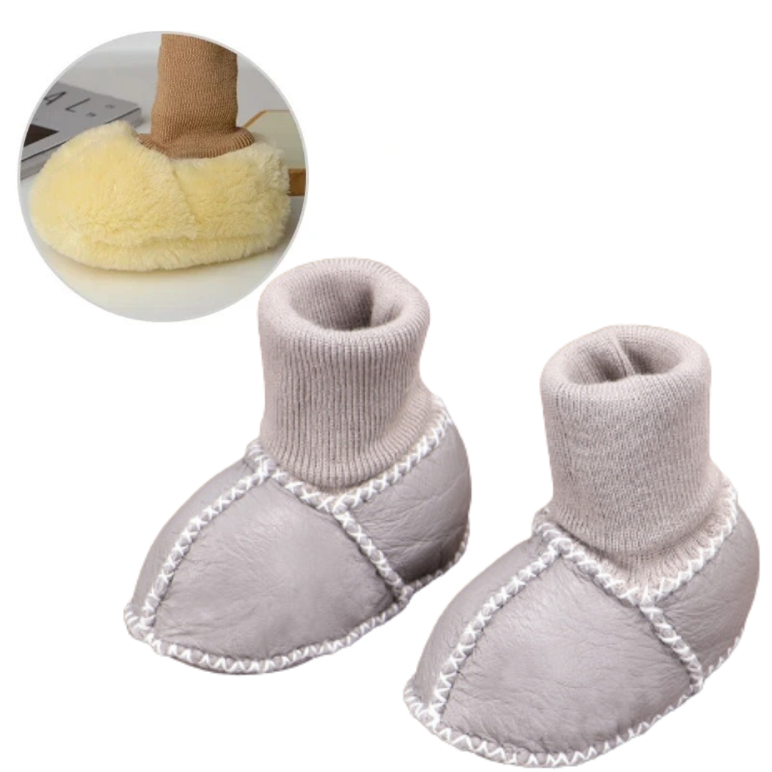 Gray baby slippers with pale knit cuffs and light contrast seams