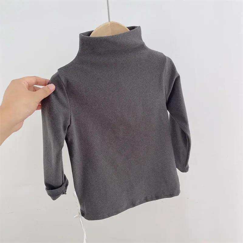 Gray long-sleeve baby sweater with a high round neckline on a wooden hanger.