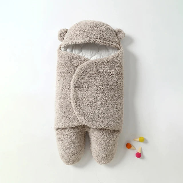 Gray baby wrap blanket with a textured sherpa finish and adjustable front wings.