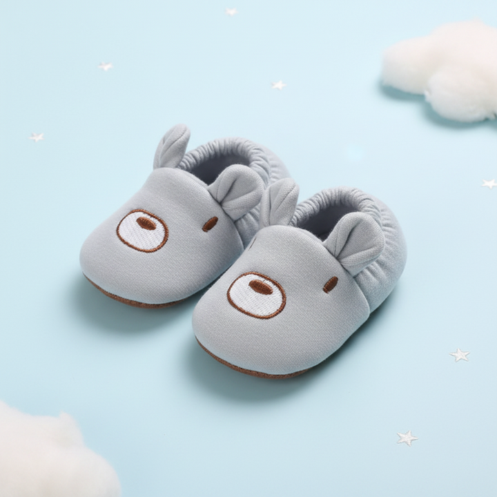 Gray bear-face baby shoes with rounded ears and soft ankle cuffs.