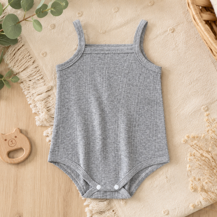 Gray cotton baby bodysuit with thin straps and white bottom snaps