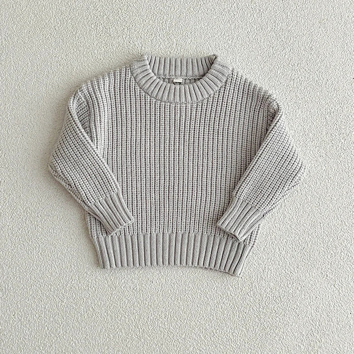 Gray cotton knit sweater with a round neckline, long sleeves, and ribbed cuffs and hem.
