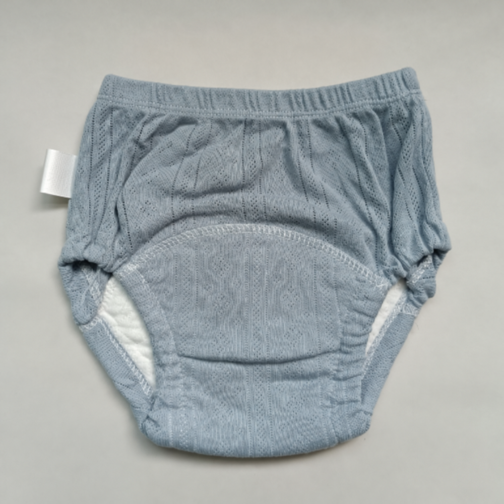 Gray cotton training pants showing the curved absorbent panel and gathered waistband.