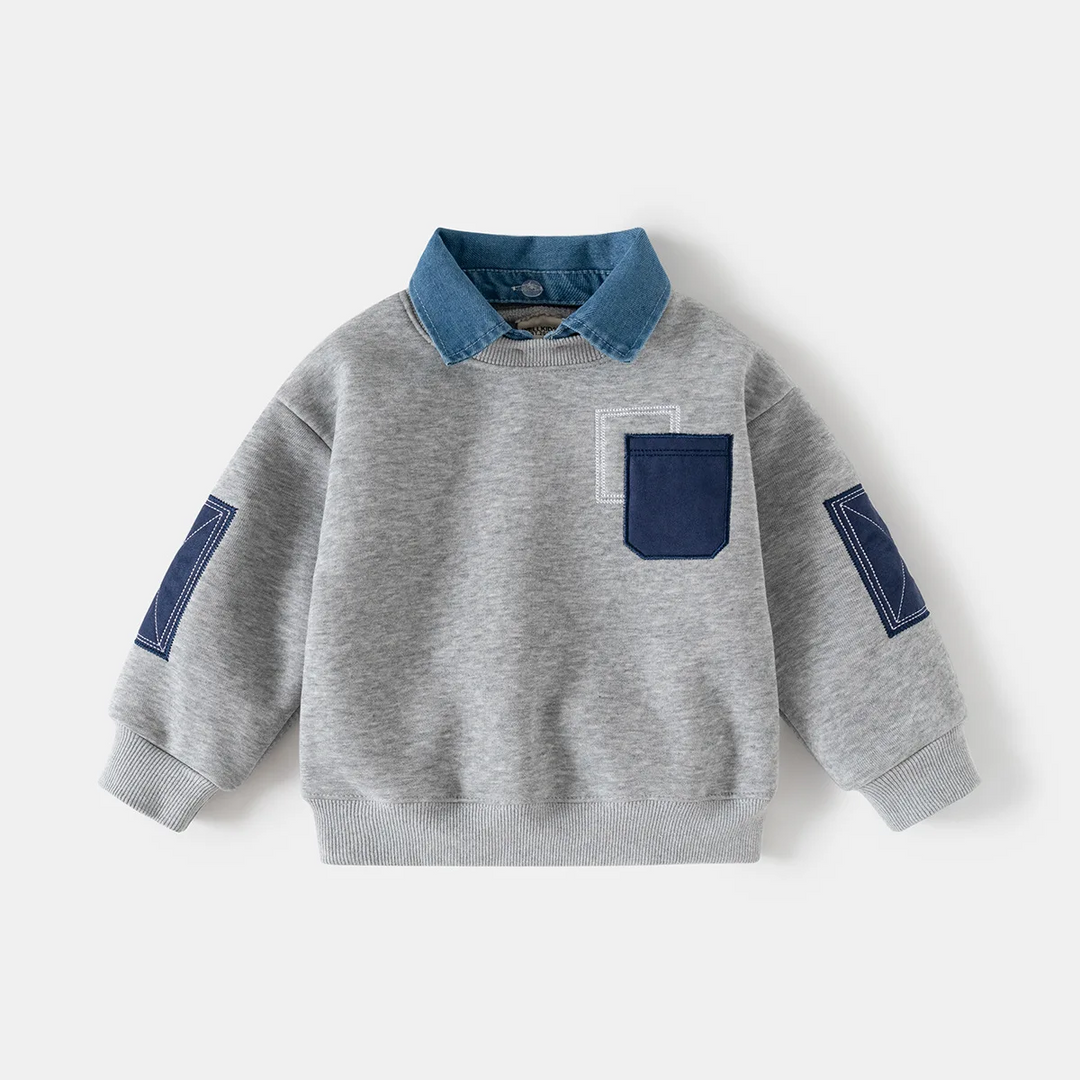 Gray pullover sweater with a denim shirt collar, navy pocket and ribbed cuffs