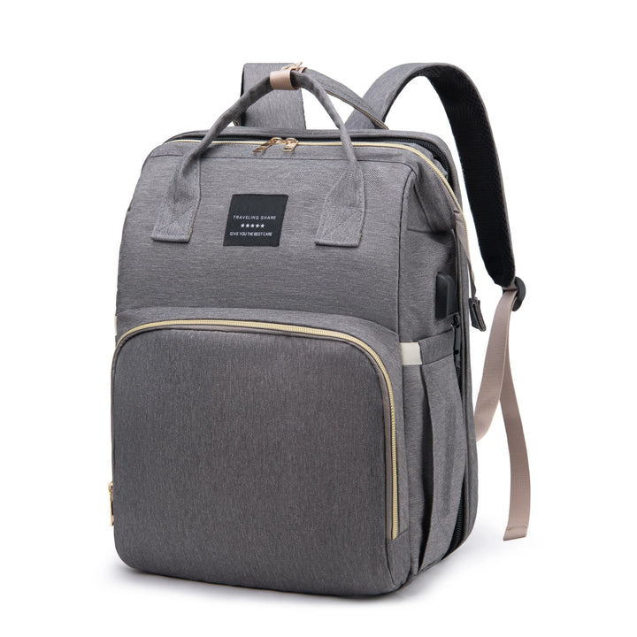 Gray diaper backpack with a front zippered pocket and side storage pockets.