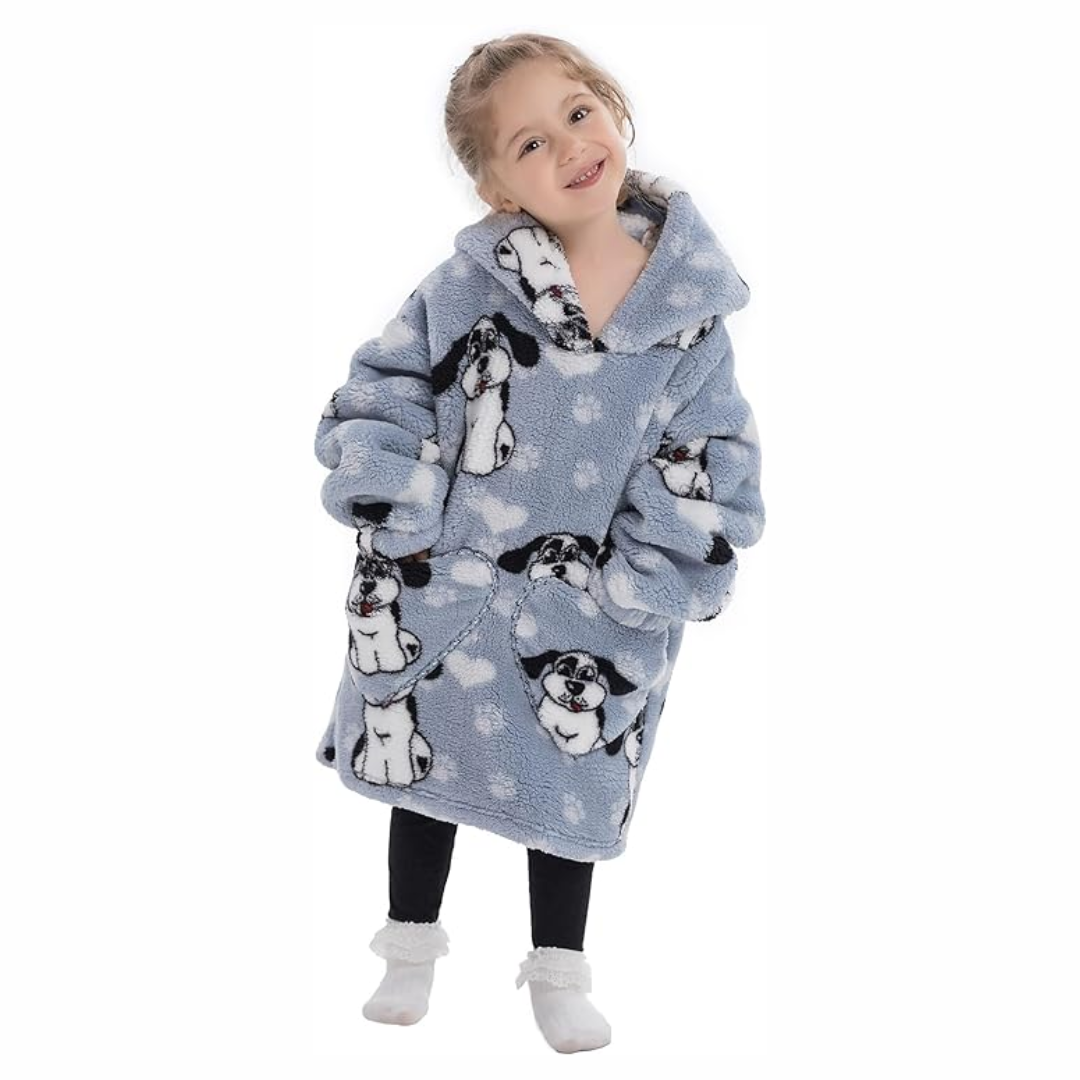 Child wearing a gray dog-print hooded blanket with hands in the front pockets