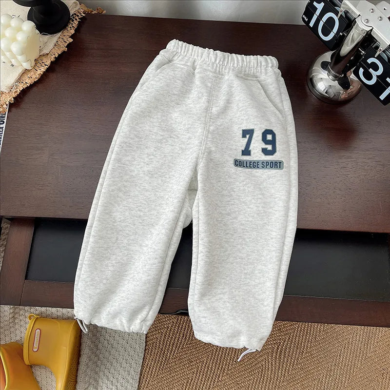 Gray joggers with an elastic waistband, navy 79 graphic and gathered ankles