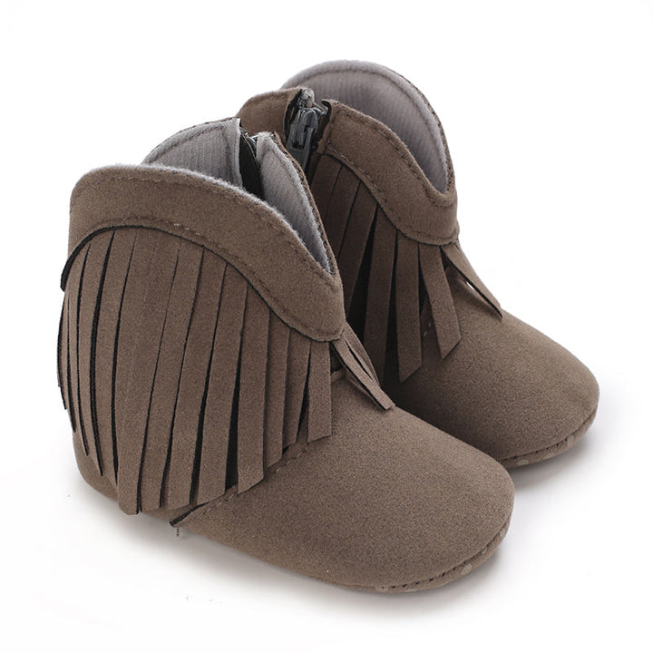 Gray baby cowboy boots with fringe trim and curved cuffs