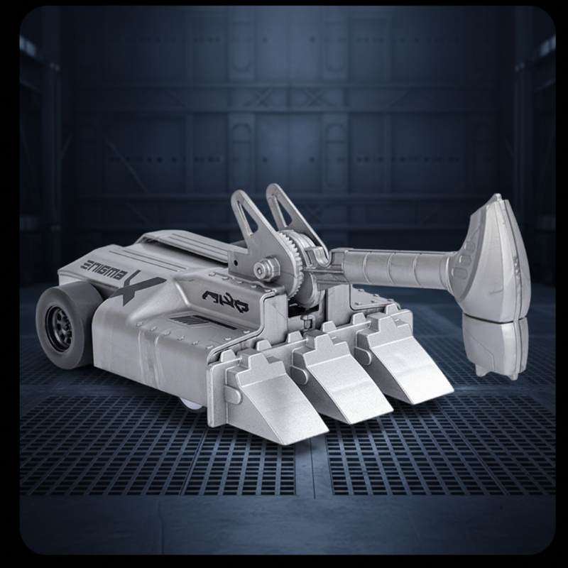 Gray armored RC car with its hammer extended and three front forks lowered
