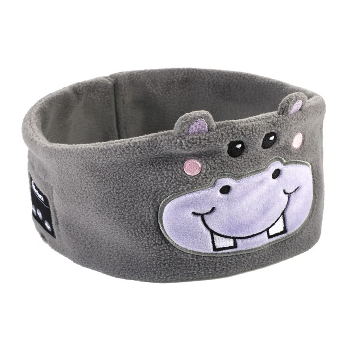 Gray hippopotamus Bluetooth sleep mask with small ears, a smiling face, and side controls.