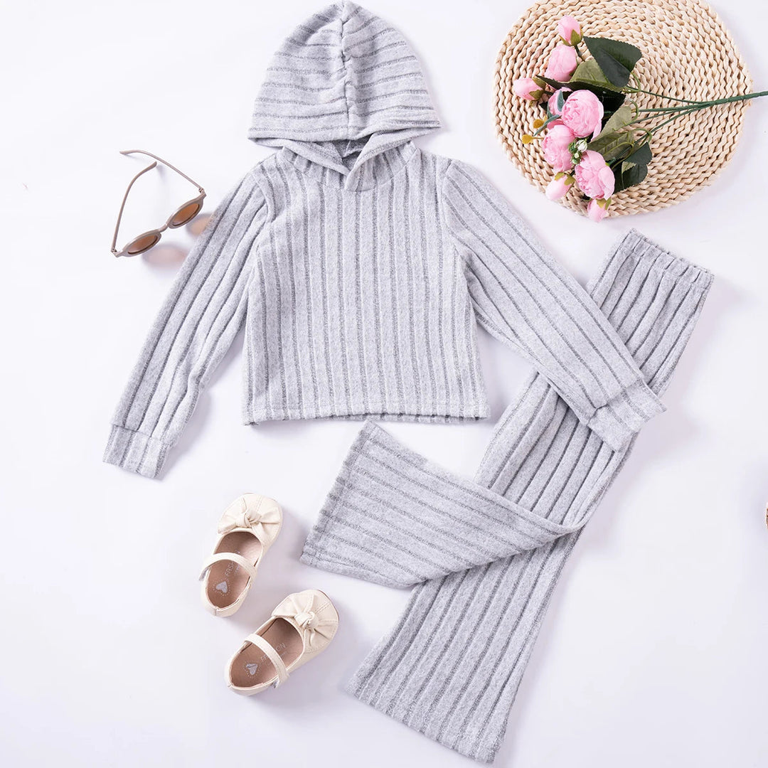 Front view of a gray ribbed hooded top and matching flared pants laid flat.
