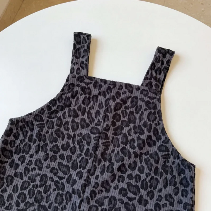 Gray leopard print overall bib and shoulder straps shown close up