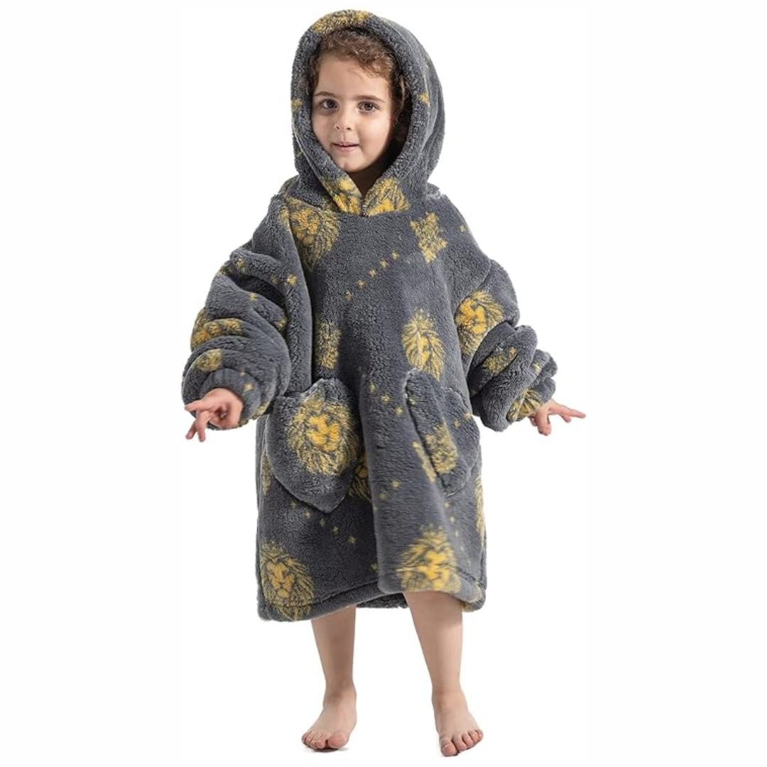 Child wearing a gray lion-print hooded blanket with the hood up