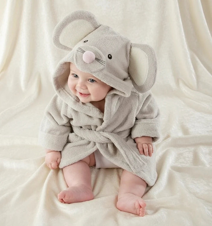 Baby wearing a gray mouse bathrobe with oversized ears, a pink nose, and a waist tie