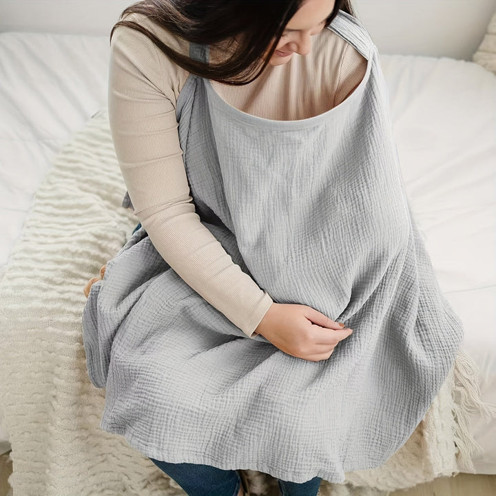 Gray nursing scarf covering a seated mother&