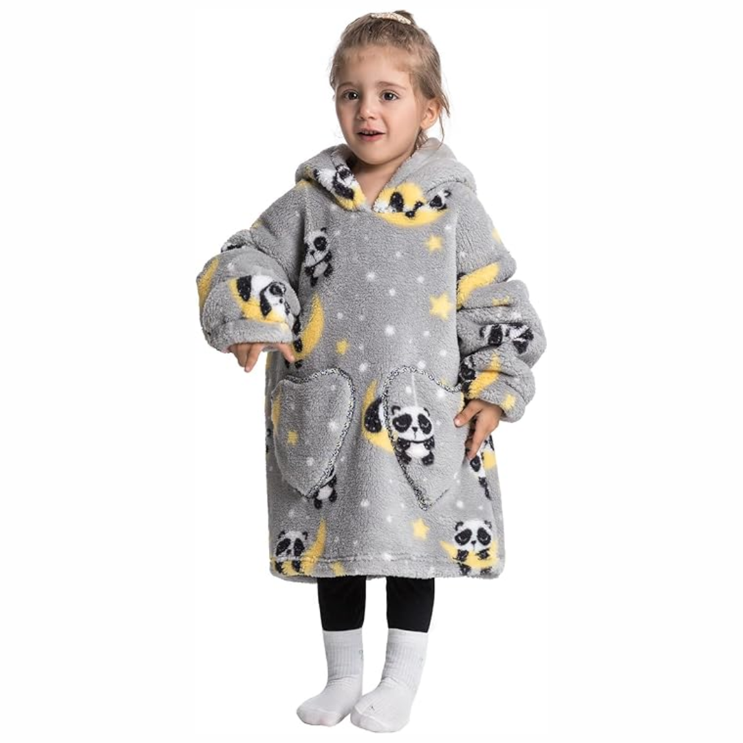 Child wearing a gray panda-print hooded blanket with yellow accents