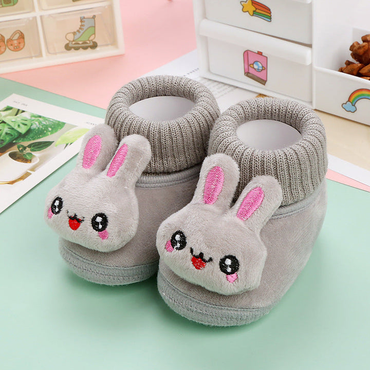 Gray rabbit baby slippers with pink ear details and knitted ankle collars
