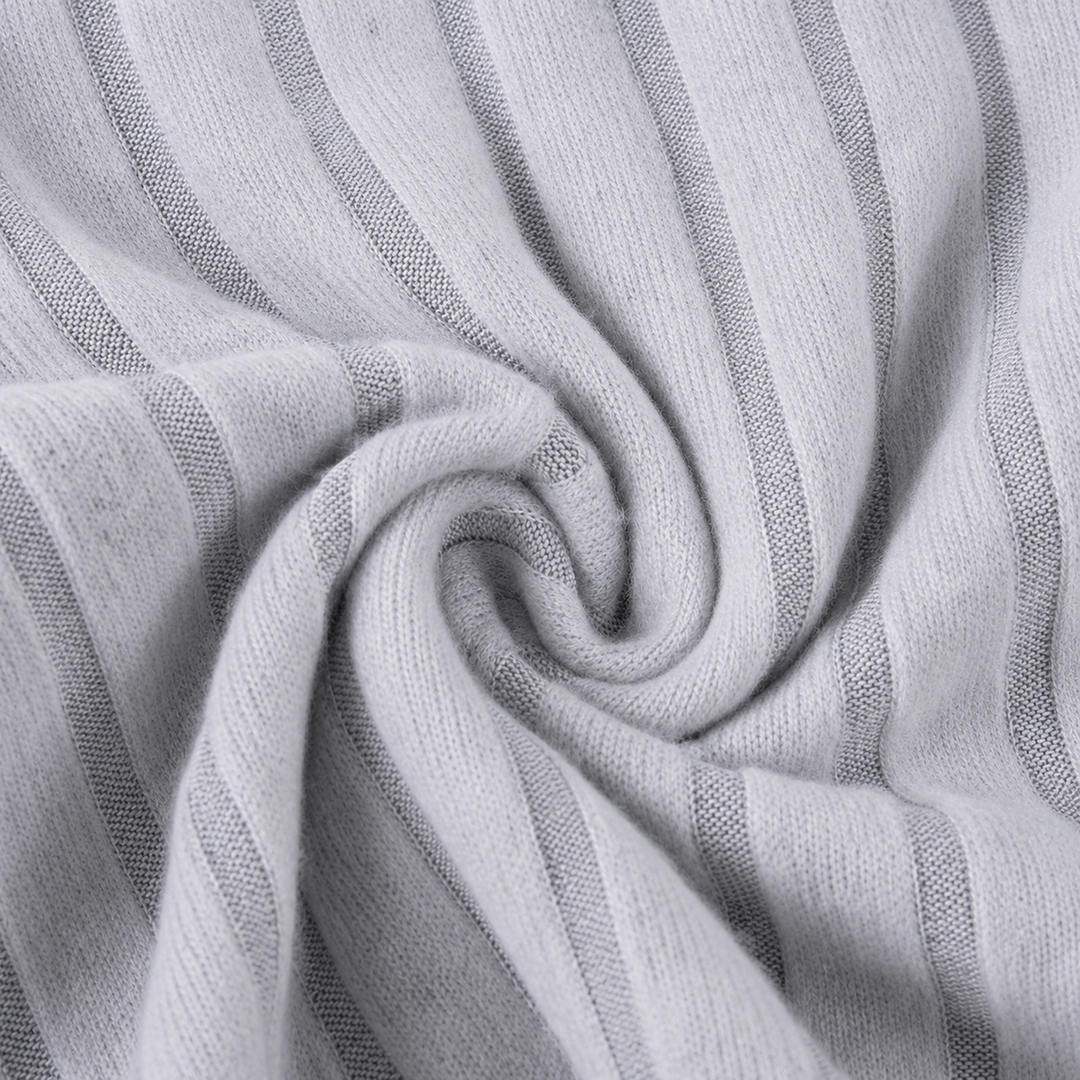 Close-up of gray ribbed fabric gathered into a swirl.