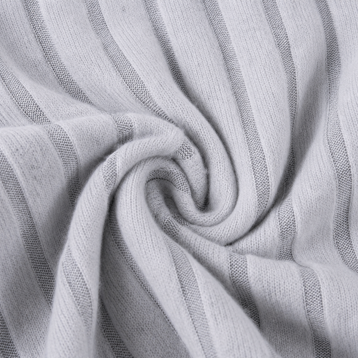 Close-up of gray ribbed fabric gathered into a swirl.