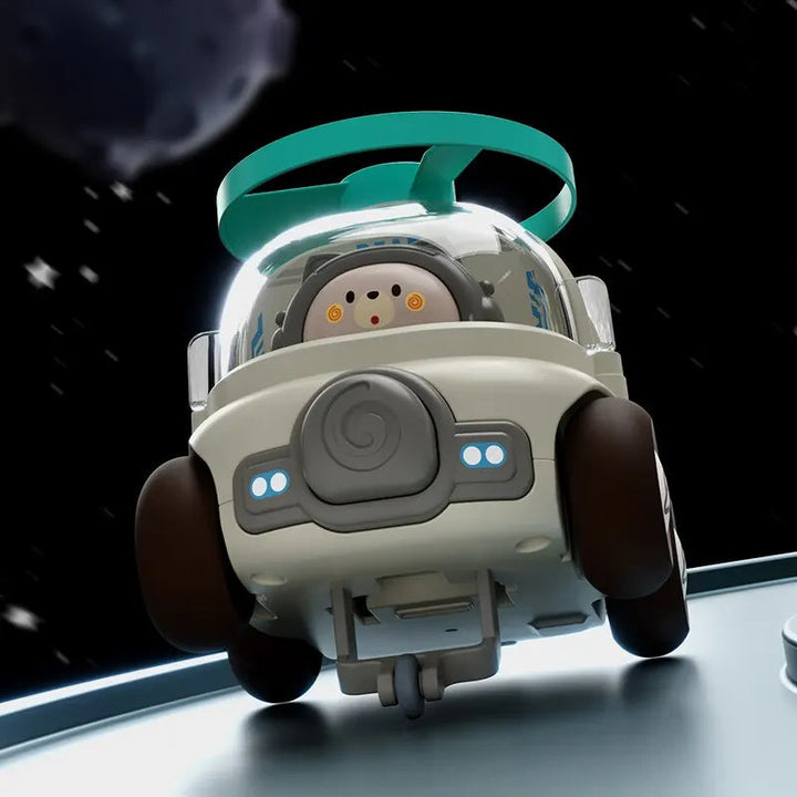Gray toy car tilted upward with a green roof rotor and clear cabin