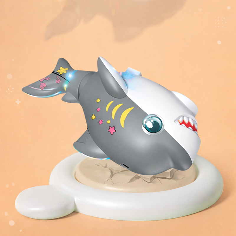 Gray shark toy tilted nose-down on a round white base against an orange background