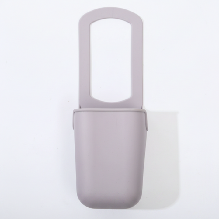 Gray silicone cup holder shown from the front against a light background.