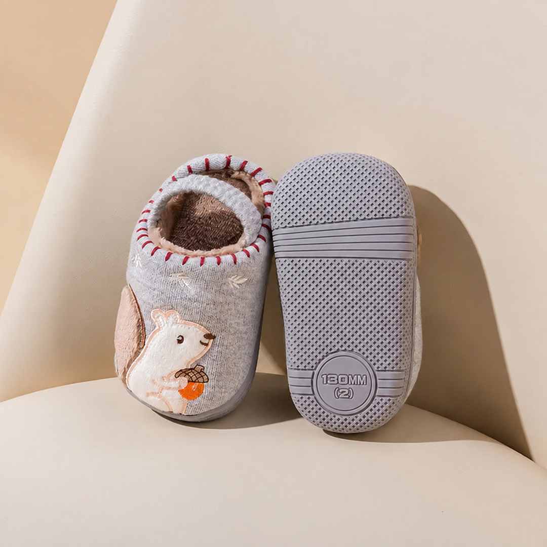 Gray squirrel slippers showing the cartoon upper and textured rubber outsole