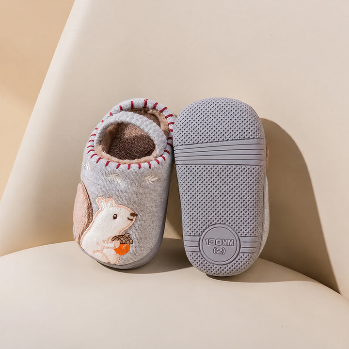 Gray squirrel slippers showing the cartoon upper and textured rubber outsole