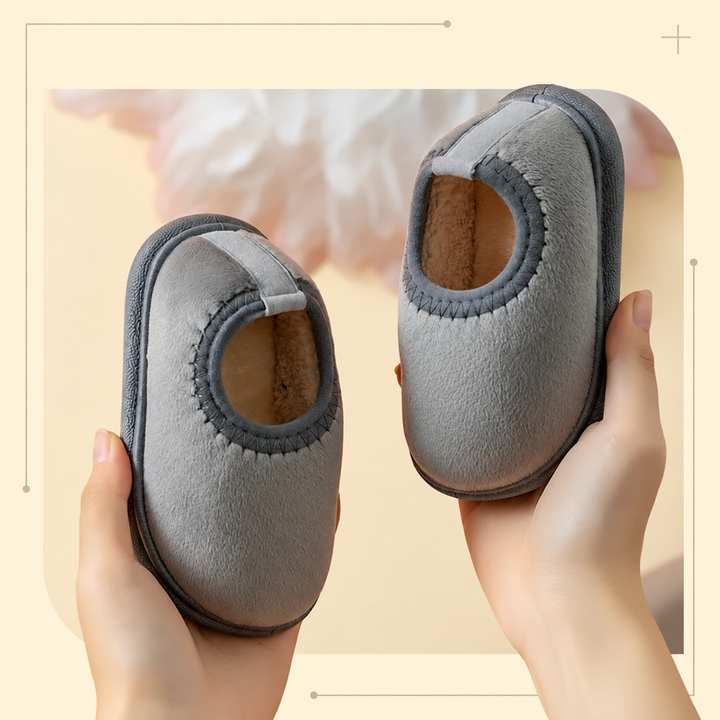 Gray suede winter slippers with stitched openings and soft tan linings