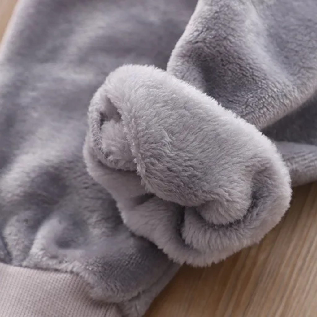 Turned-back gray tracksuit cuff showing the plush inner fabric