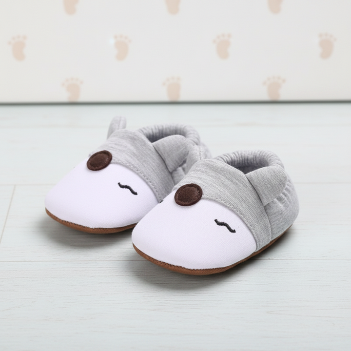 White and gray fox-face baby shoes with soft gathered ankle cuffs.