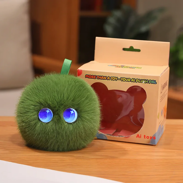 Green round AI plush toy with blue eyes beside its retail box
