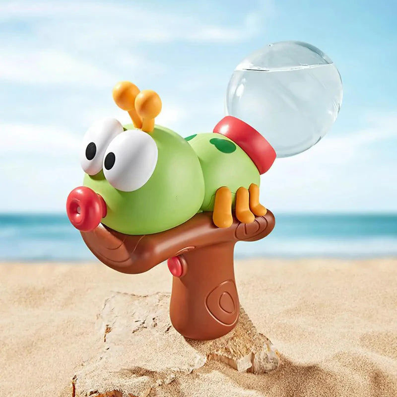 Green insect-shaped water gun with a brown grip and clear round water tank on sand.
