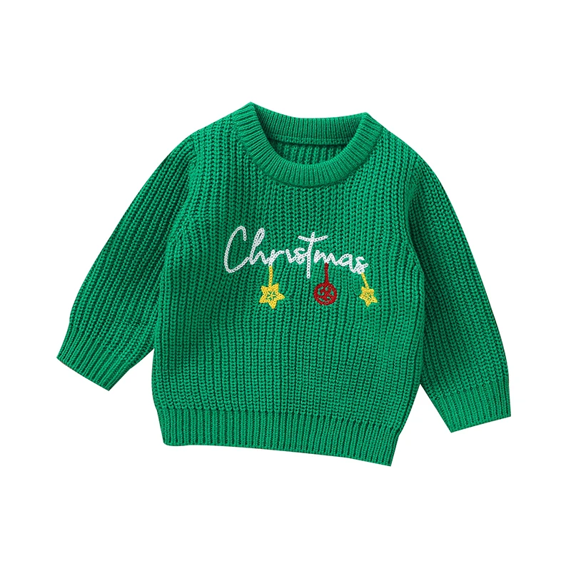 Green Christmas sweater with white lettering, yellow stars, and a red ornament.