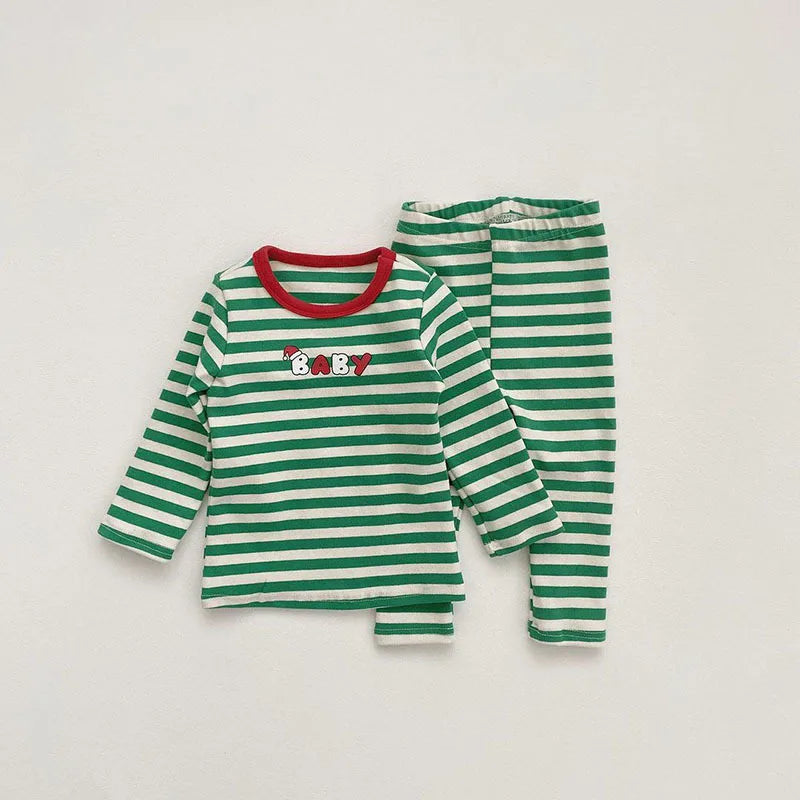 Green-and-white striped long-sleeve baby pajama top and pants with red neckline trim