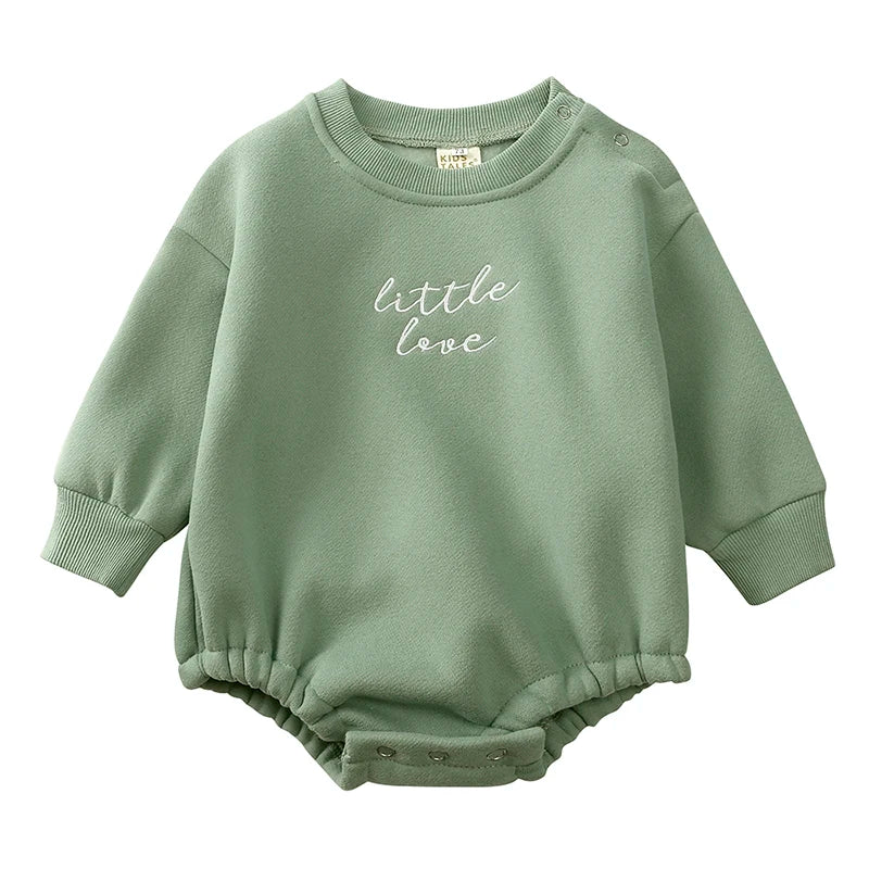 Green baby sweater romper with long sleeves, chest embroidery, and crotch snaps