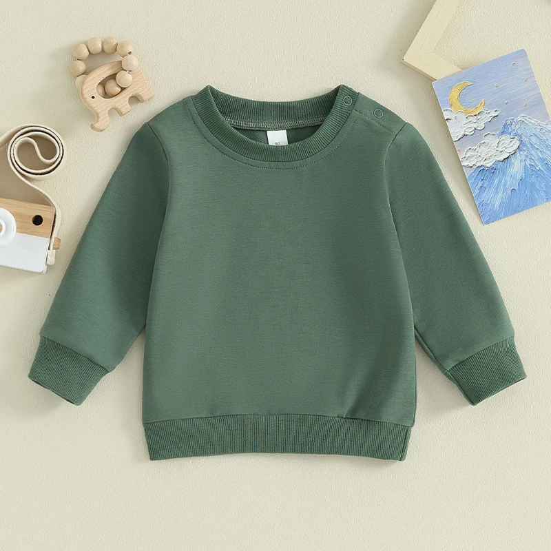 Green crewneck baby sweatshirt laid flat with long sleeves and ribbed cuffs