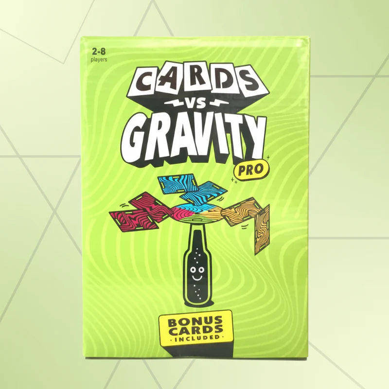 Green card game box with an illustration of cards balanced above a bottle