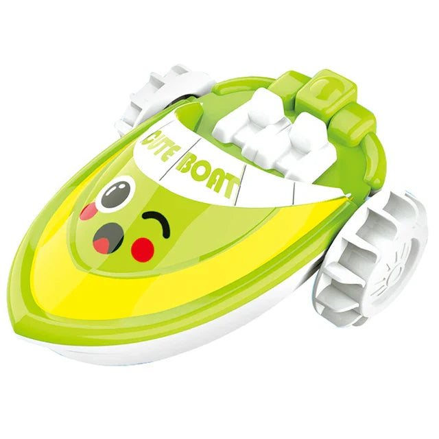Green boat bath toy with white paddle wheels and a smiling face.
