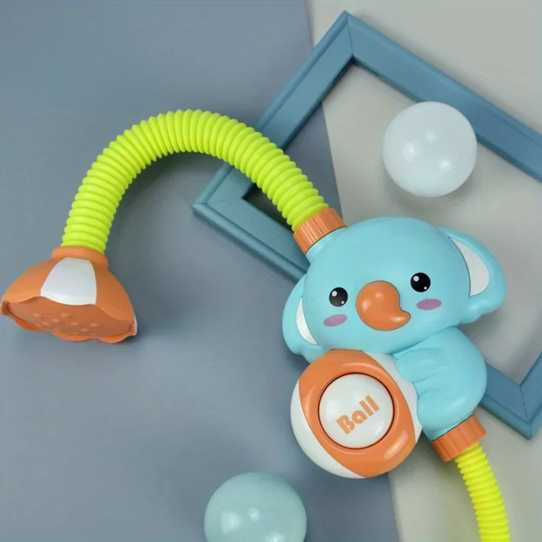 Green bath shower toy with a turquoise character, lime tubing, and an orange shower head
