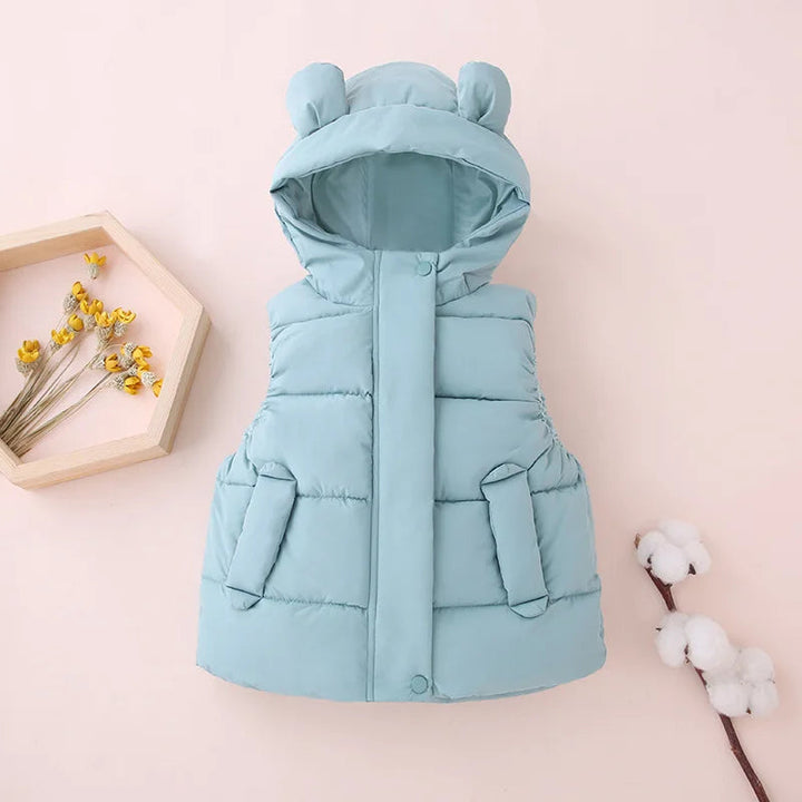 Green bear-ear hooded vest displayed on a pale pink background