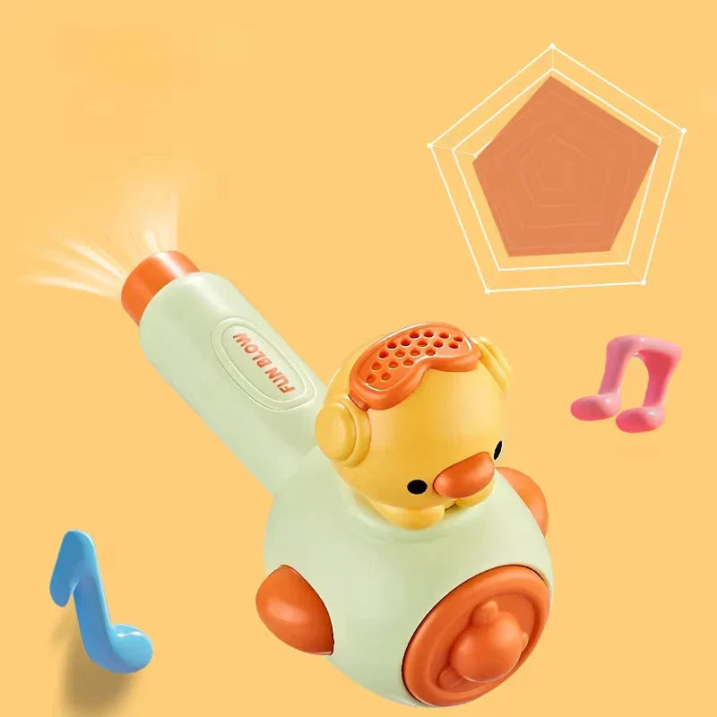 Green blowing toy fitted with a yellow chick-shaped sound attachment.