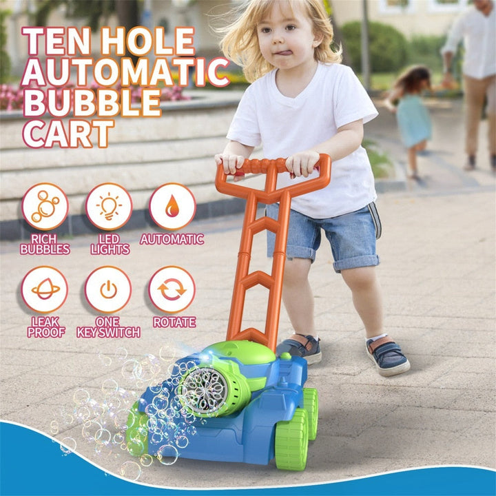 Child pushing a blue and green bubble lawn mower with an orange handle outdoors