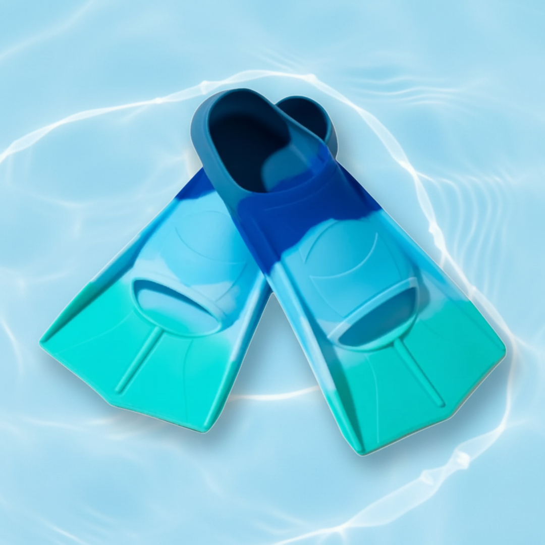 Green and blue short swim fins with open-toe foot pockets on a water-patterned background.