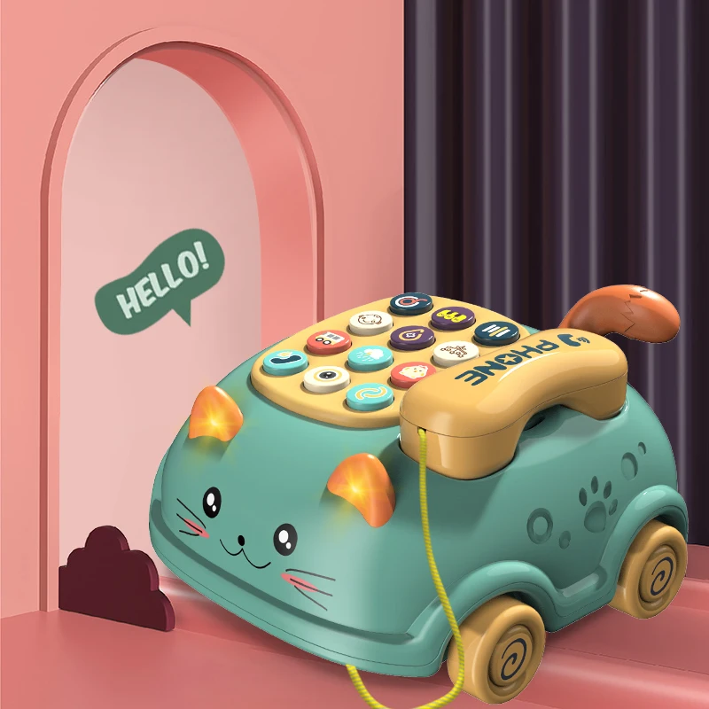Green cat-shaped toy phone with a yellow handset, wheeled base and pull cord