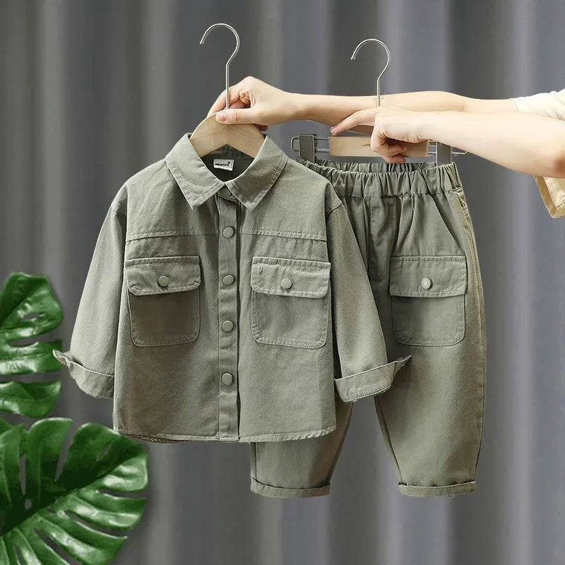 Green cotton denim shirt and pants set with flap pockets and turned-up cuffs