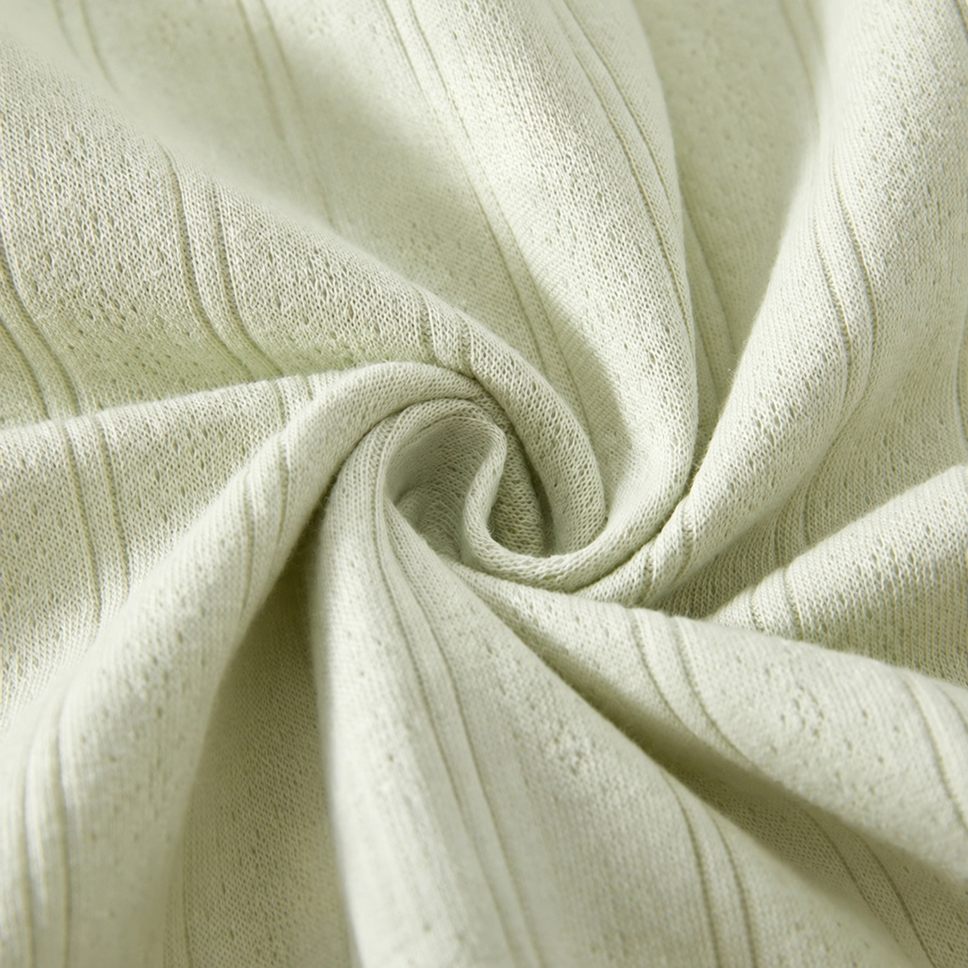 Close-up of the green baby romper&