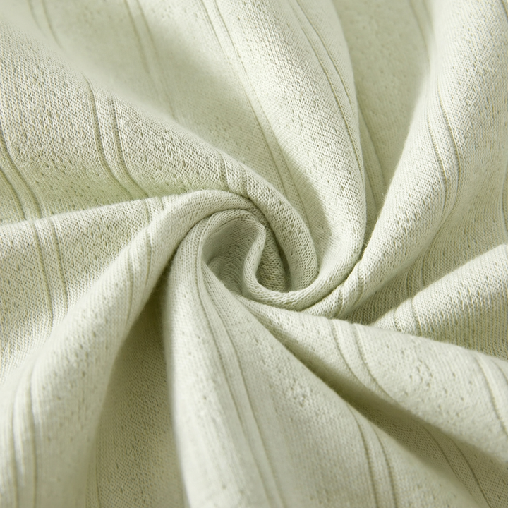 Close-up of the green baby romper&
